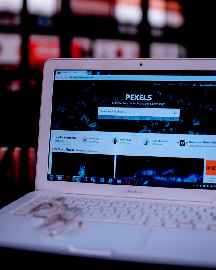 who-we-are Laptop on a desk showing the Pexels homepage, highlighting its web interface.